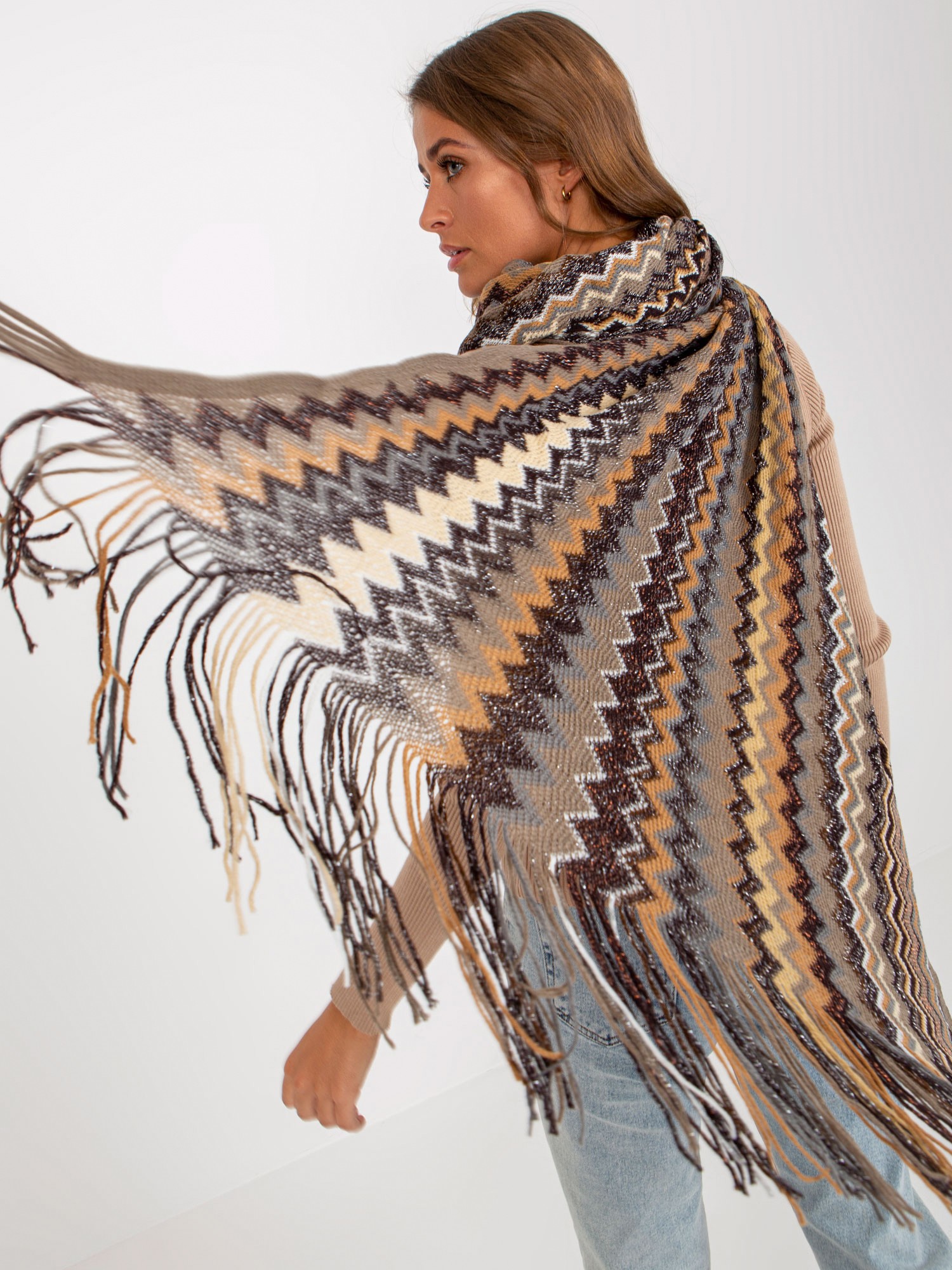 Lady's beige patterned scarf with fringe