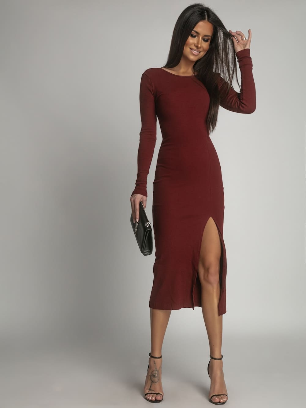 Elegant burgundy dress with an open back and a slit at the front