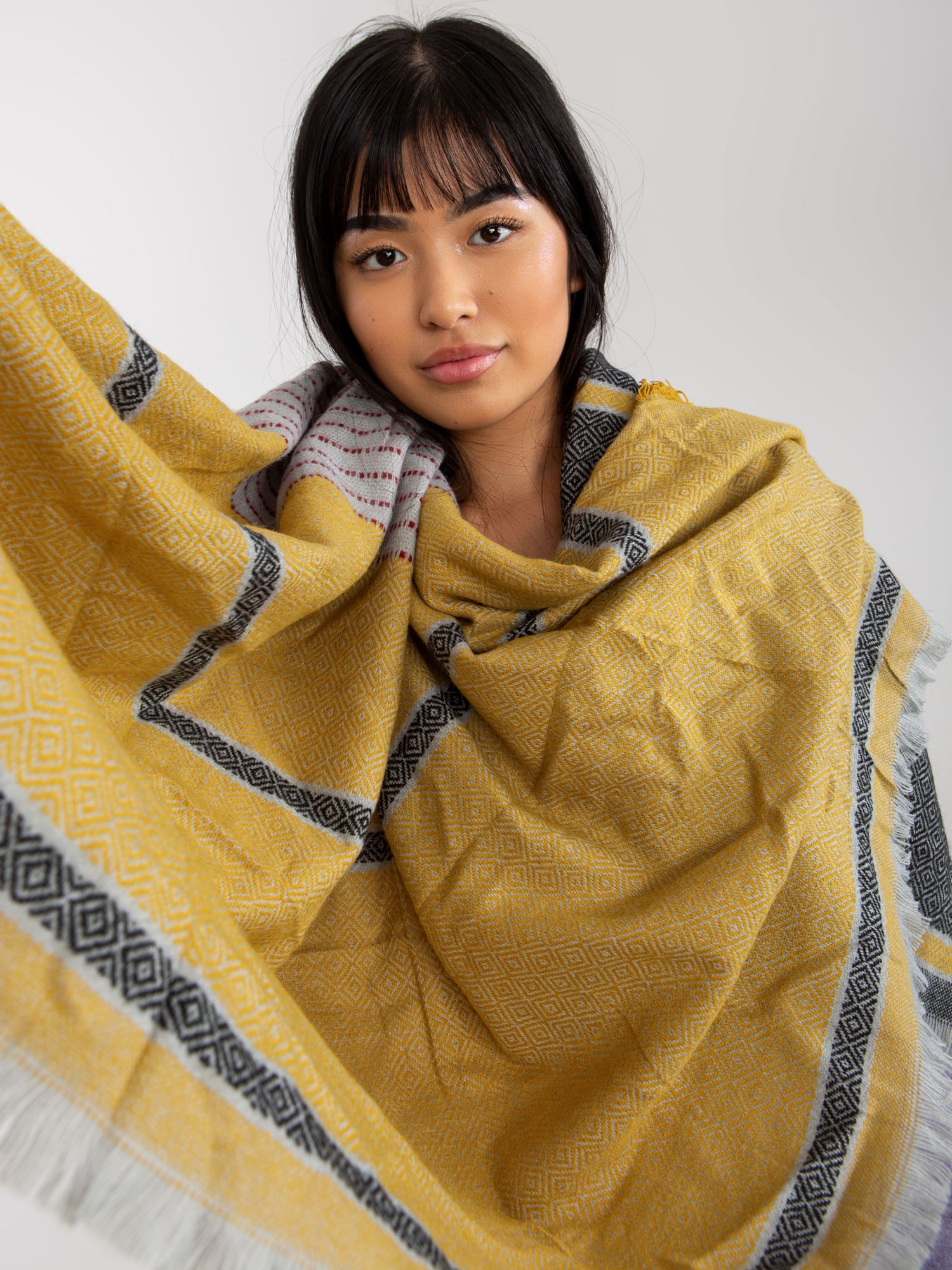 Lady's black-and-yellow patterned winter scarf