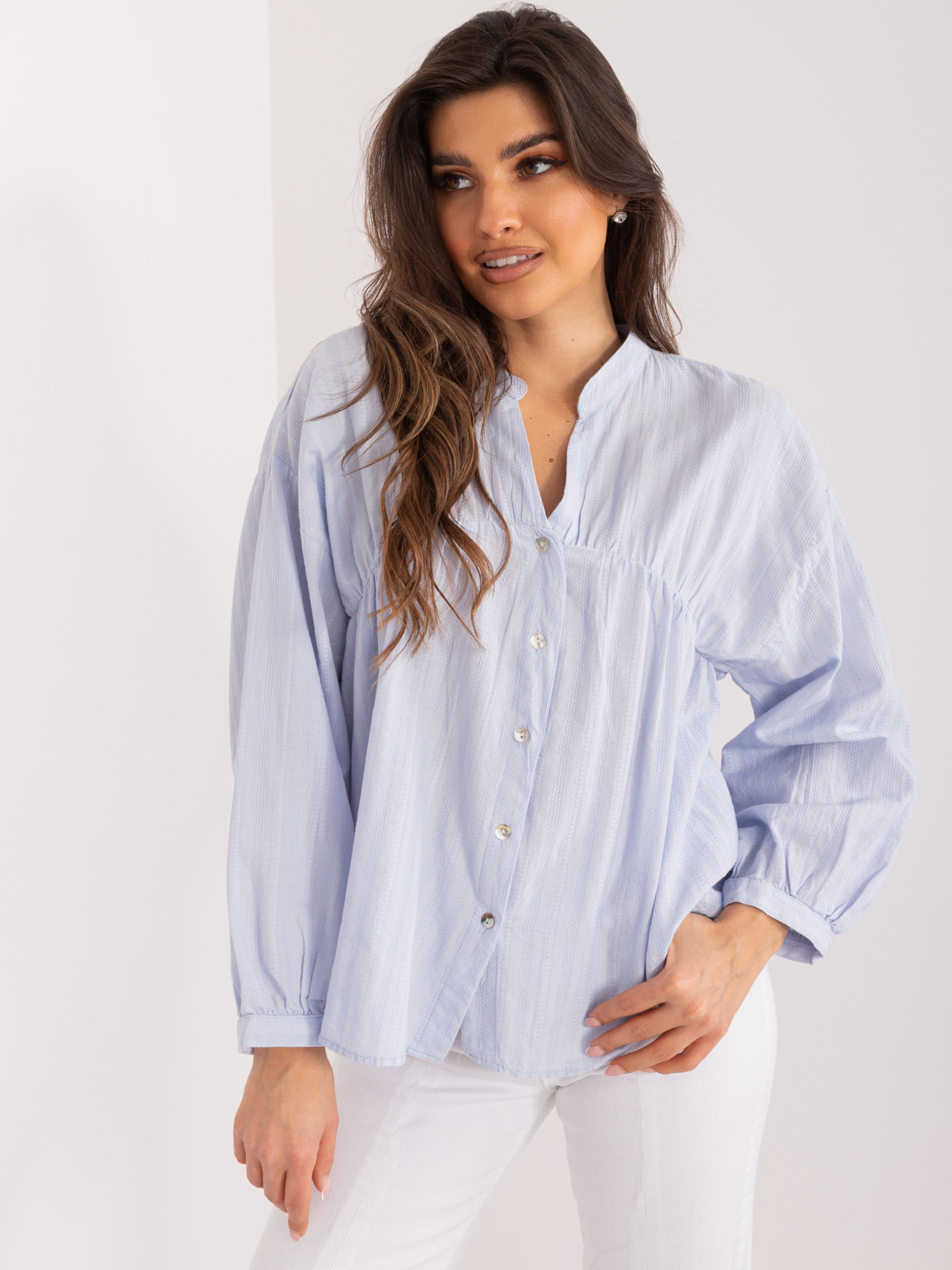 Light blue women's oversize shirt with stand-up collar