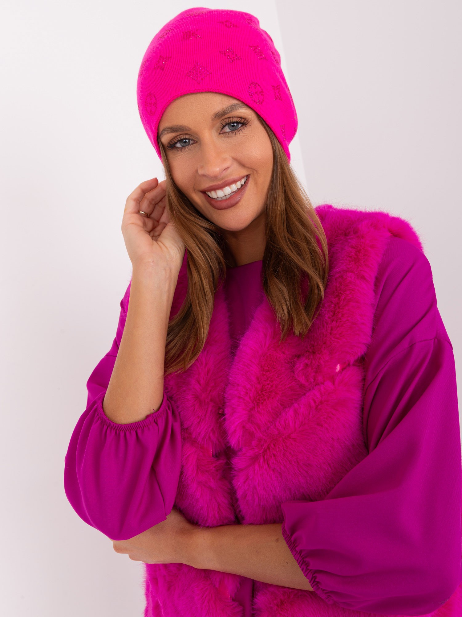 Dark pink winter hat with appliqués
