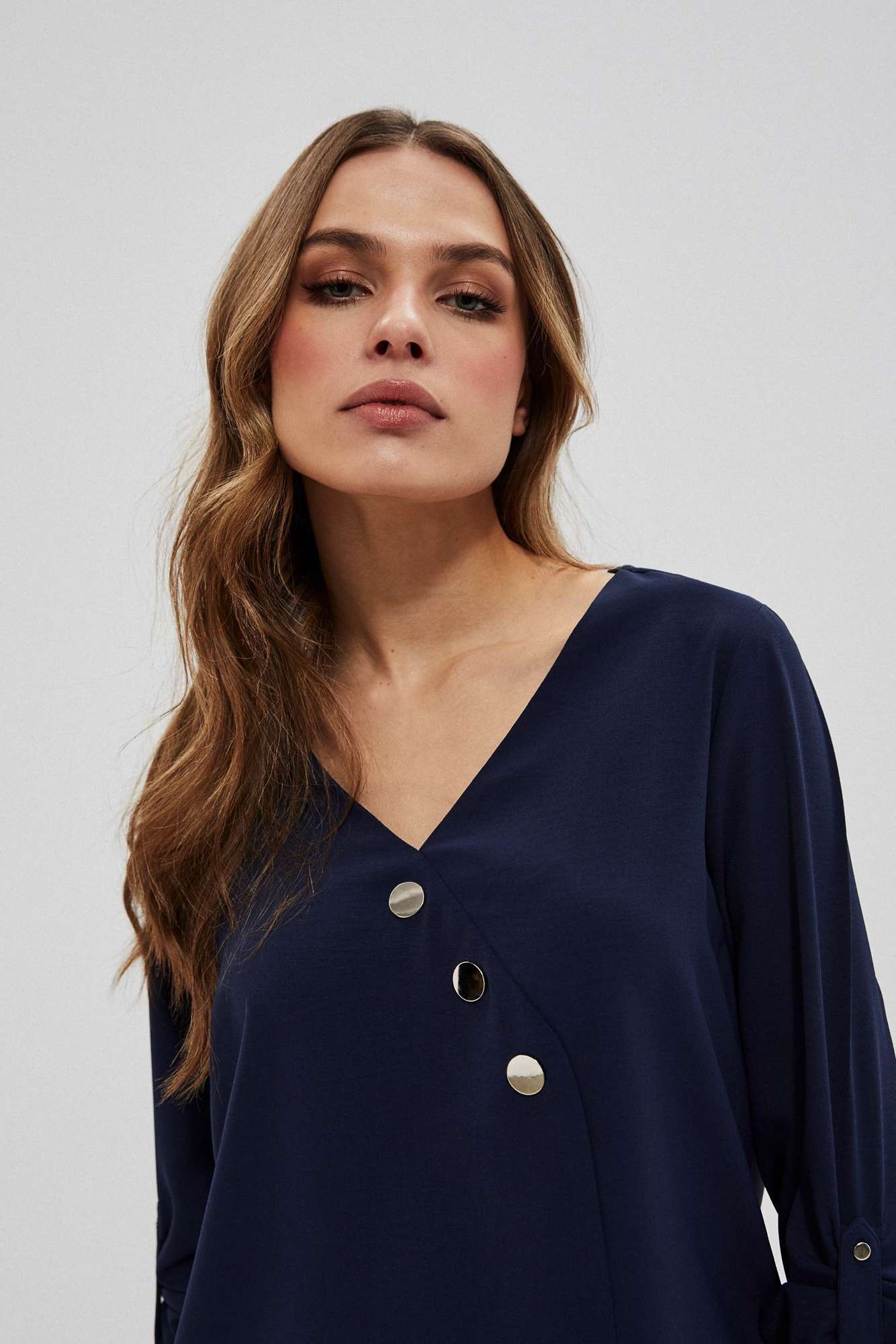 Shirt with decorative buttons