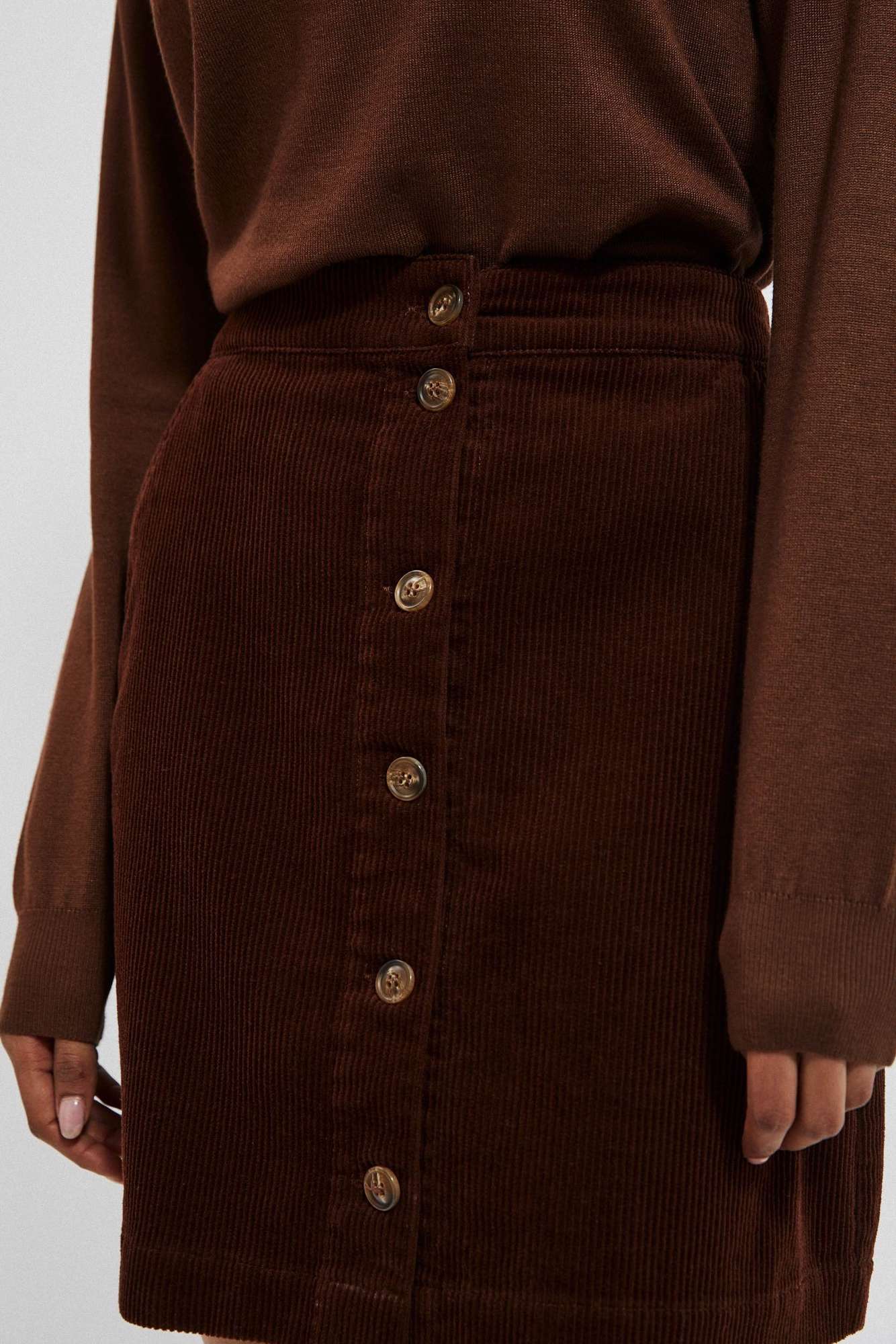 Suede skirt with decorative buttons