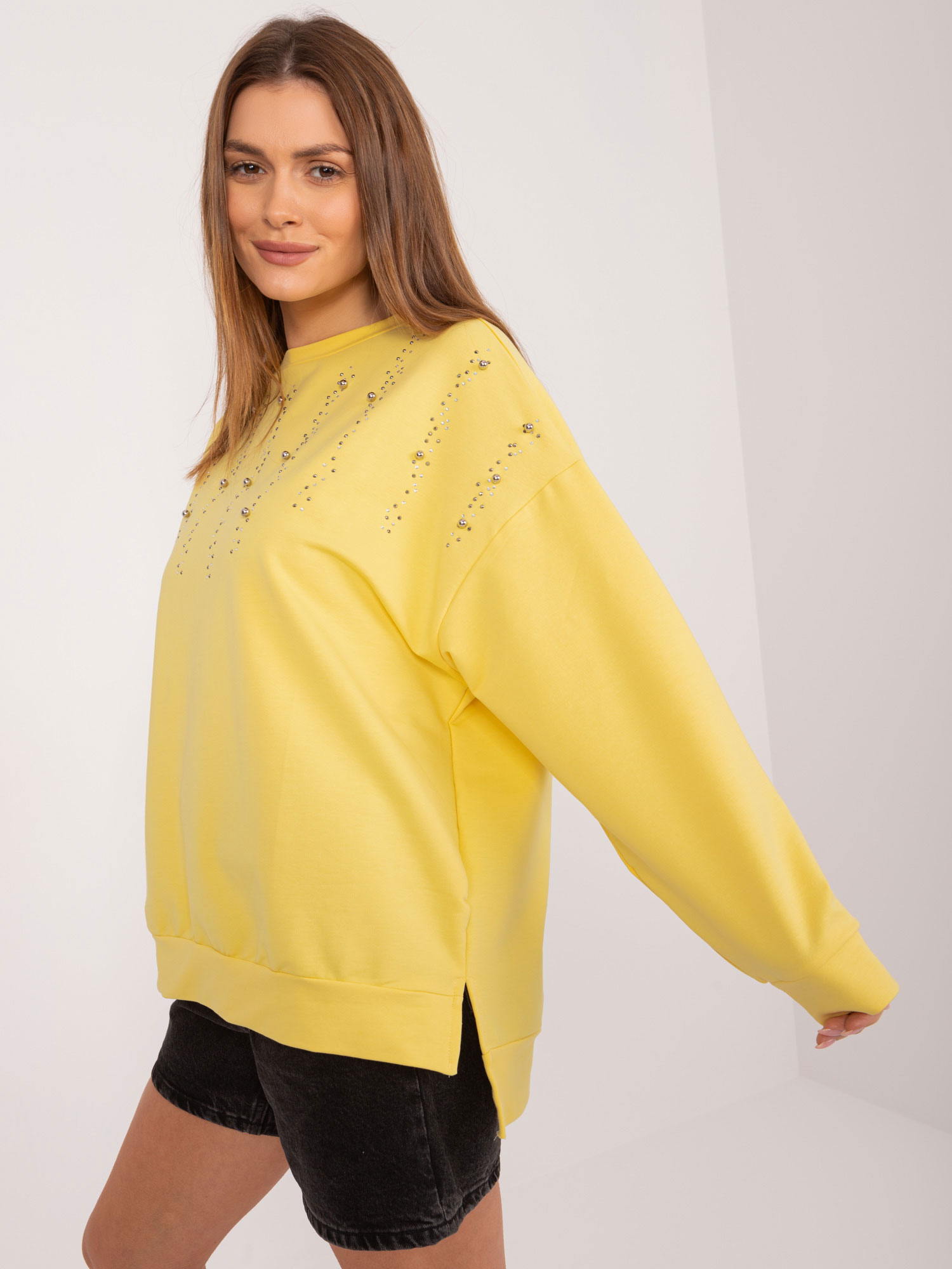 Yellow hoodie with appliqués
