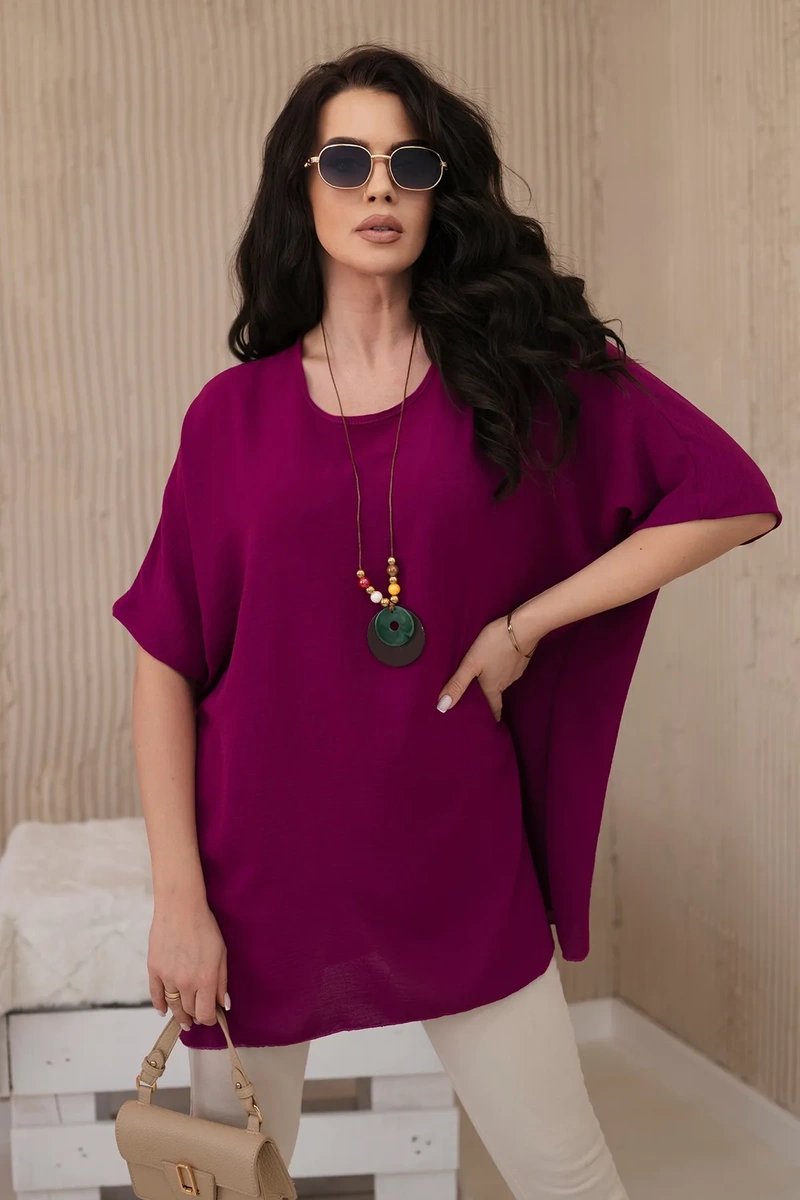 Oversized blouse with plum pendant