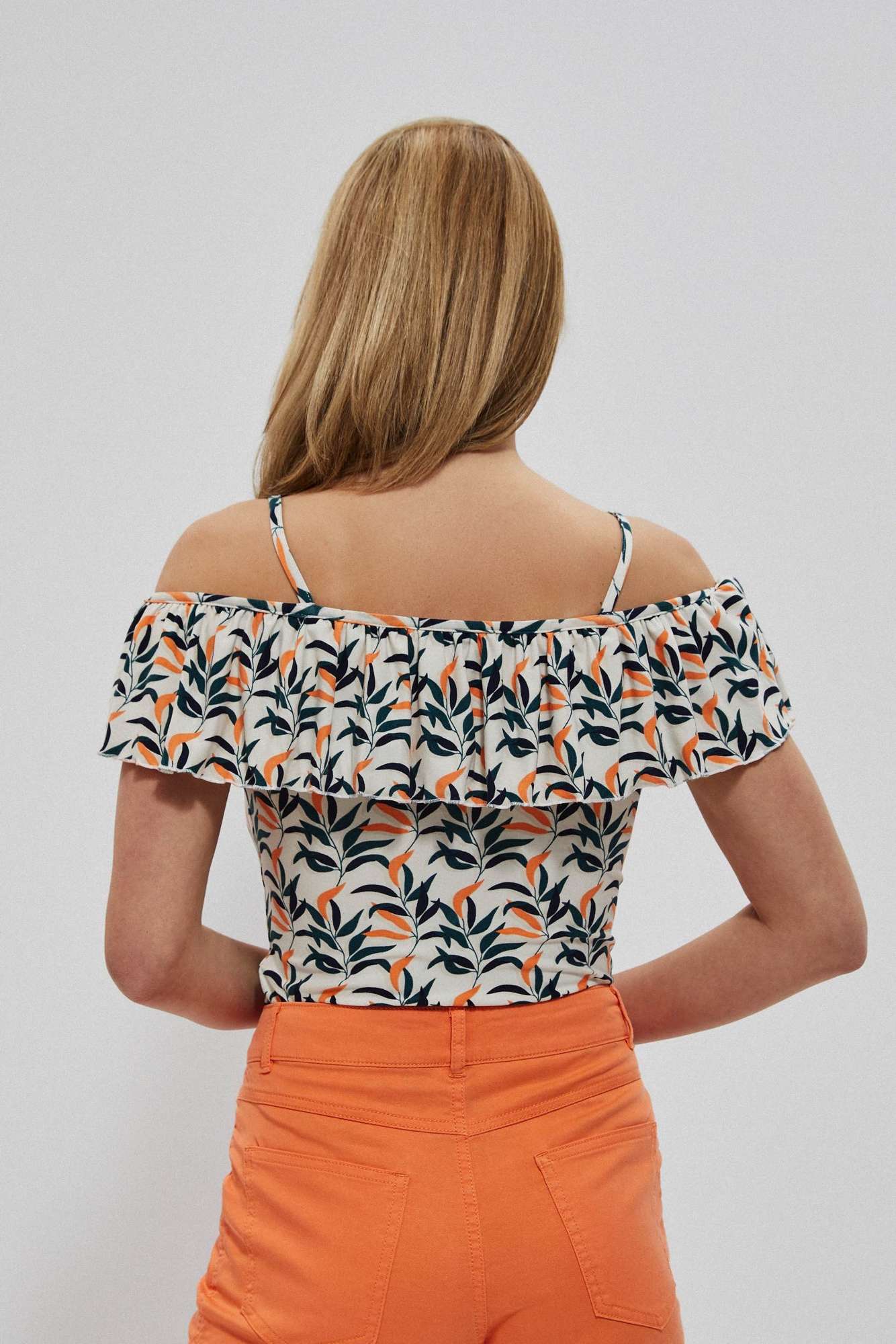 Sleeveless blouse with ruffles