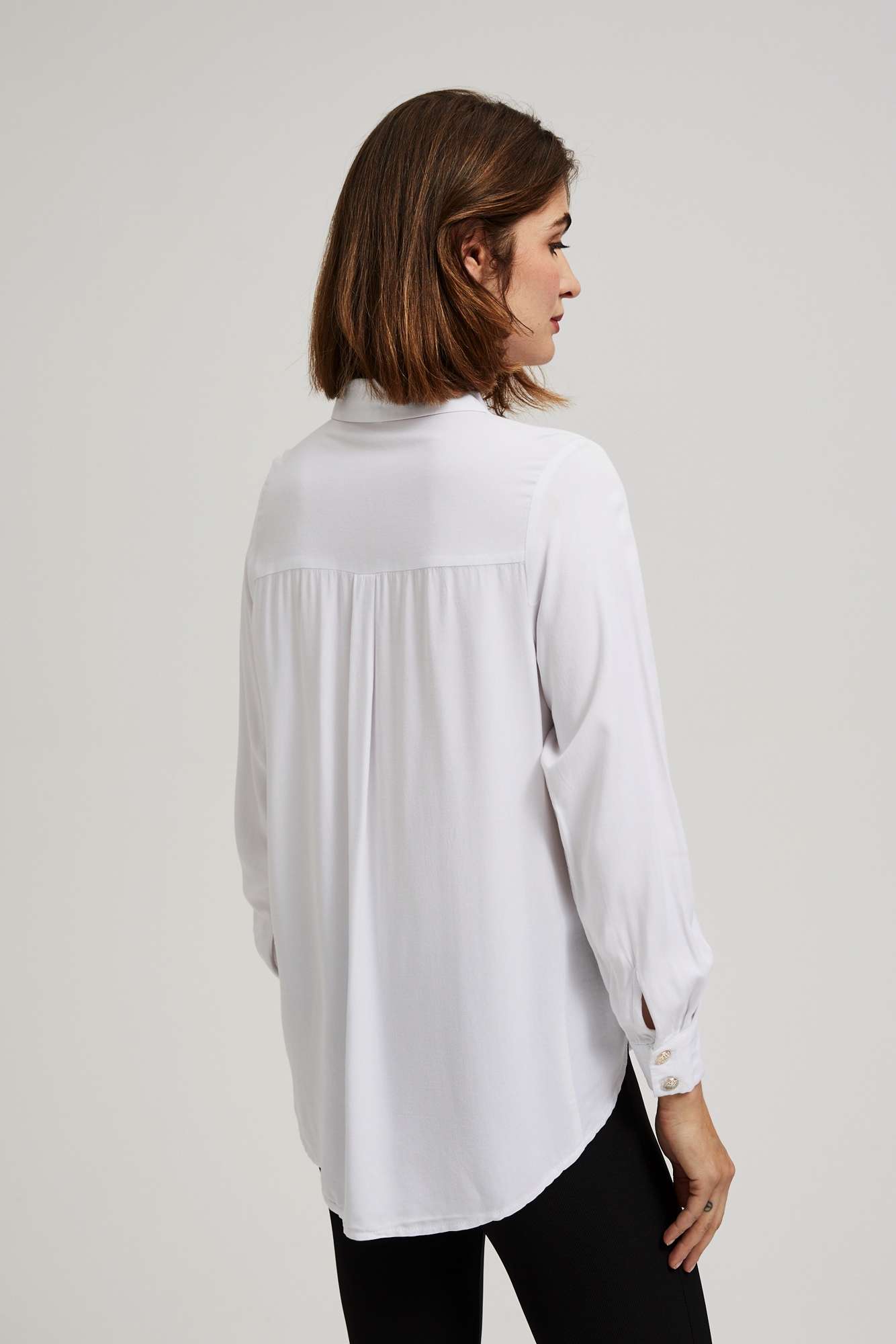 Shirt with decorative buttons