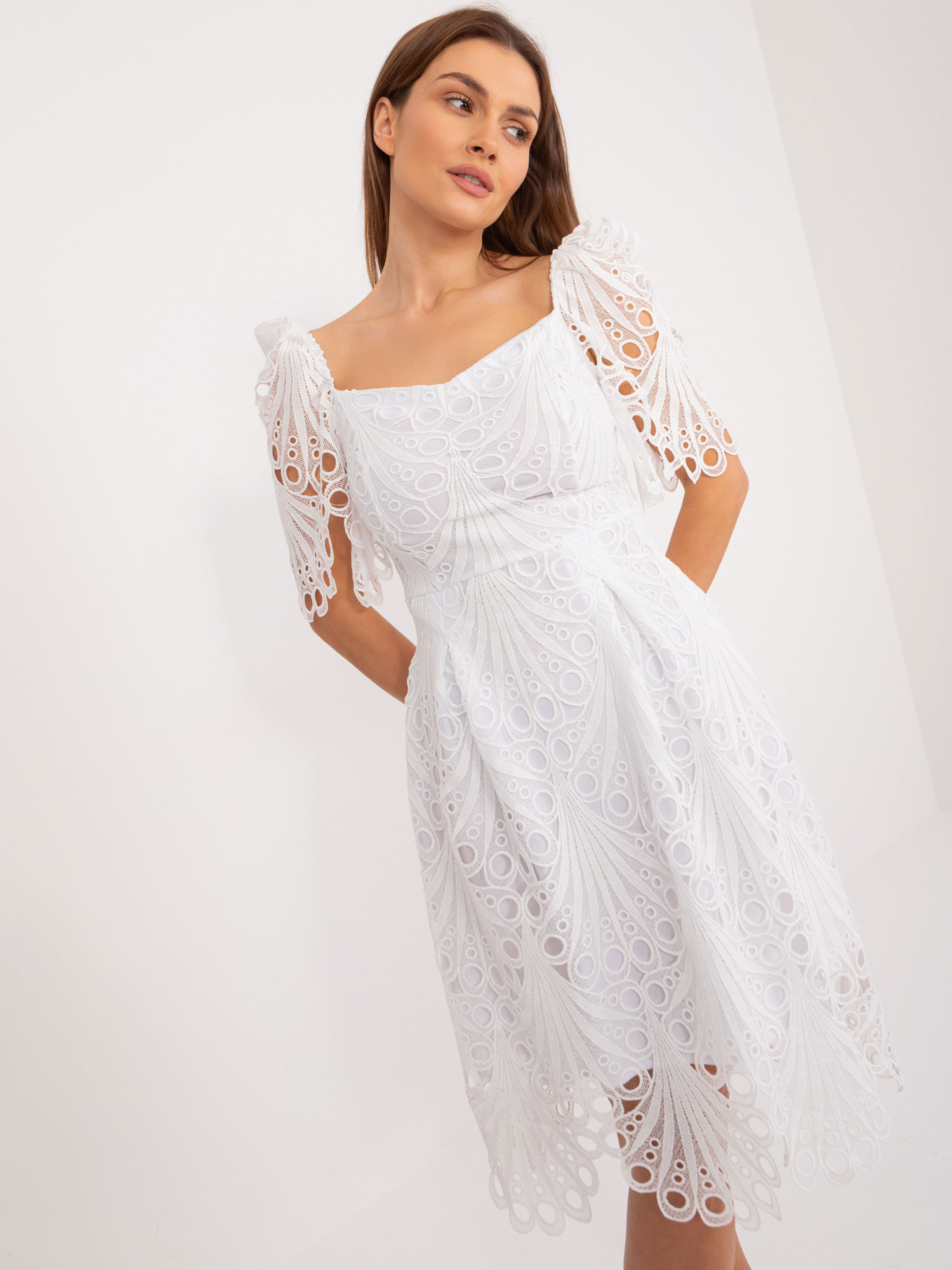 White midi dress with an openwork pattern
