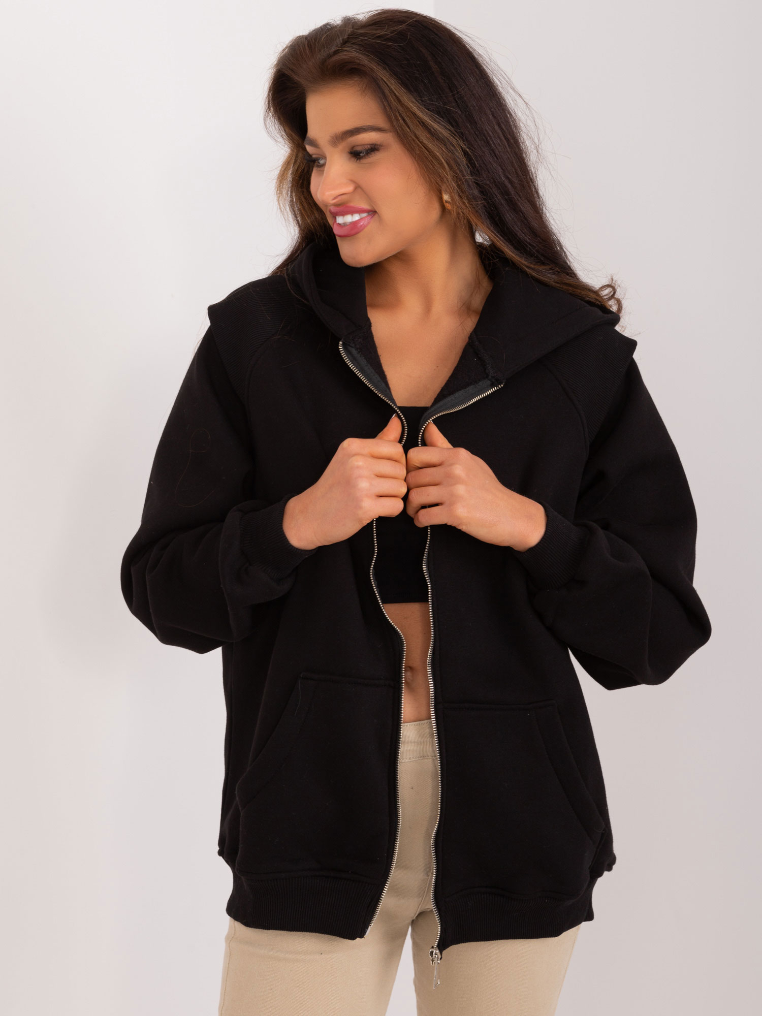 Black zip-up sweatshirt with ribbed inserts
