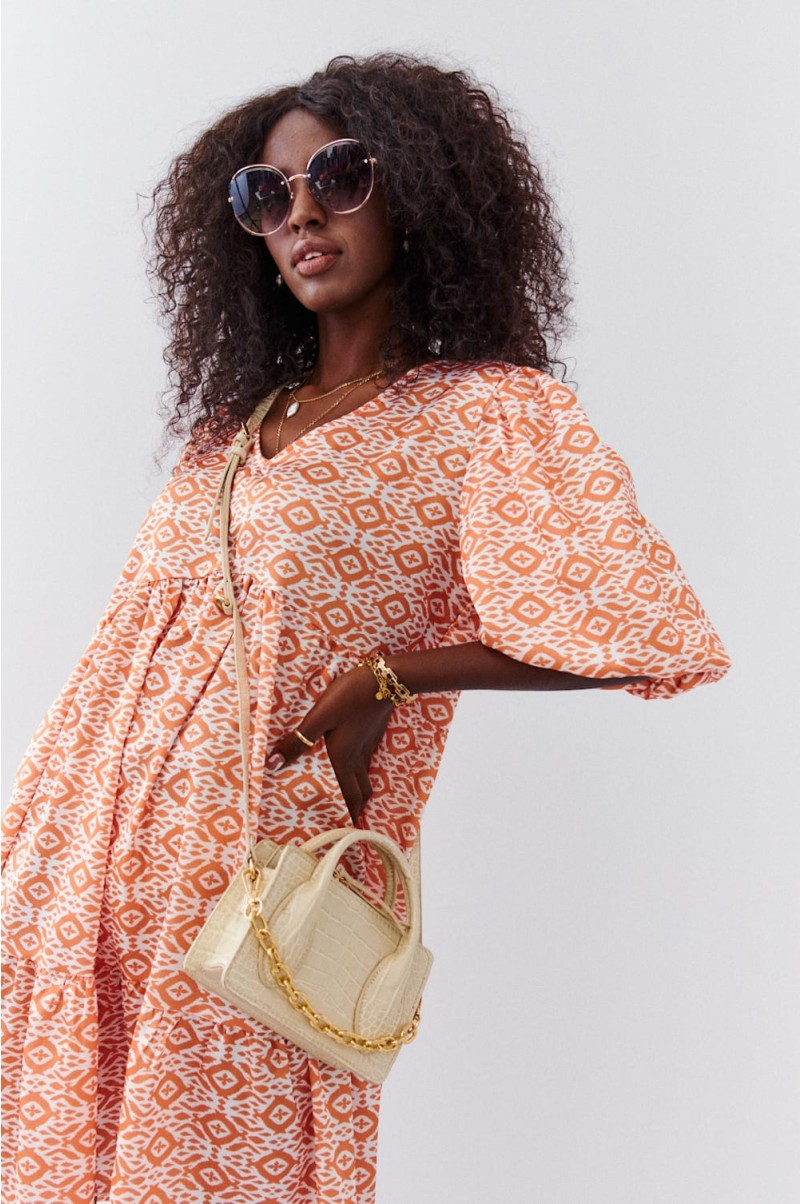 Loose dress with puff sleeves in light orange
