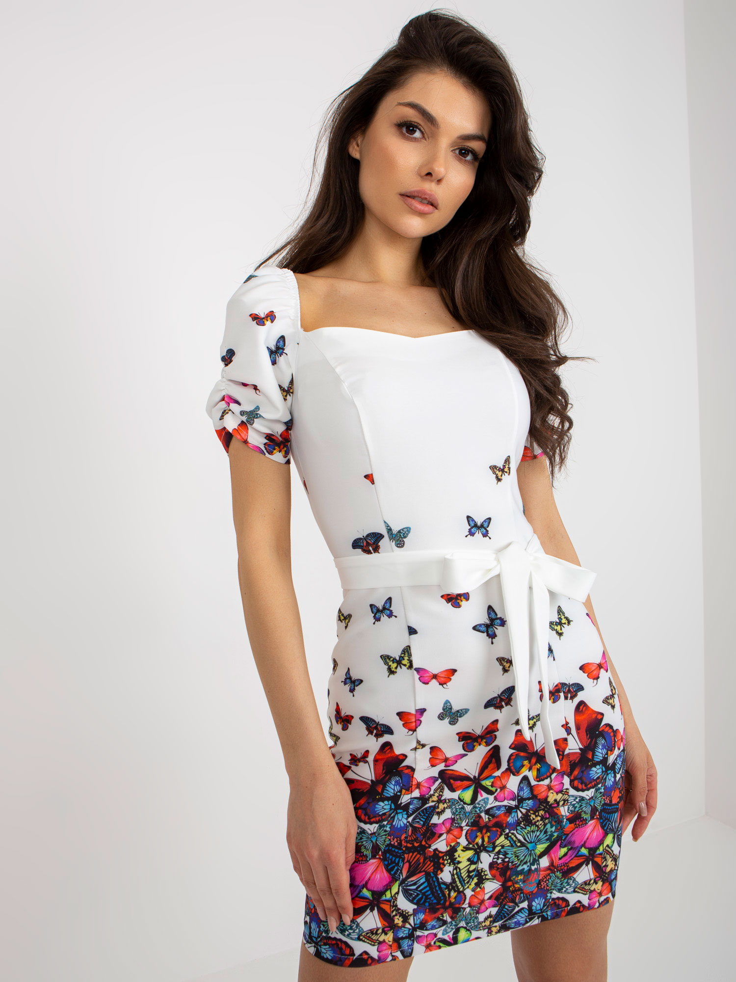 White fitted cocktail dress with print