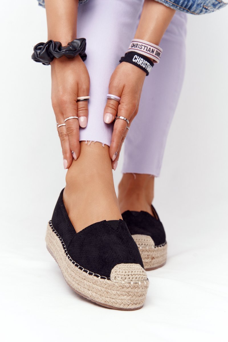 Espadrilles on a straw platform of the Black Highway