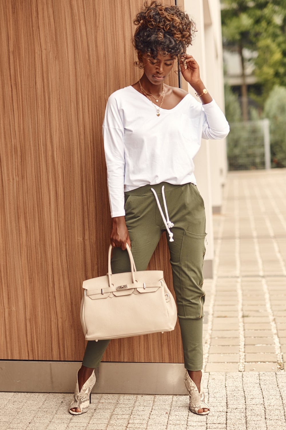 Set of women&#039;s cargo pants and white-khaki blouse