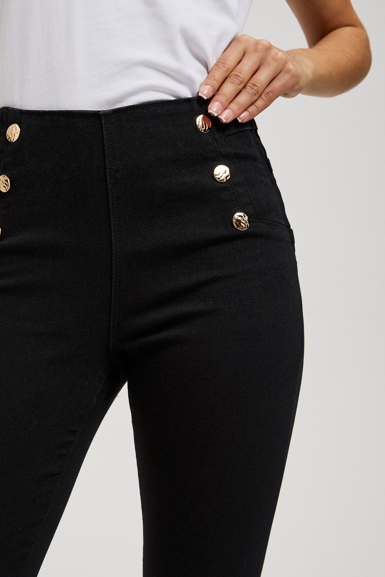Jeans with decorative buttons