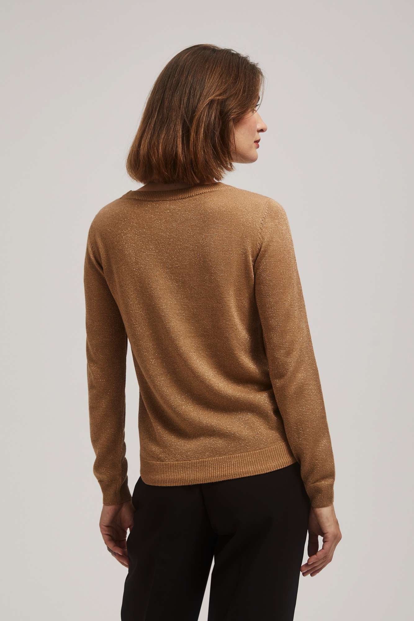 Sweater with metal thread and tie-up