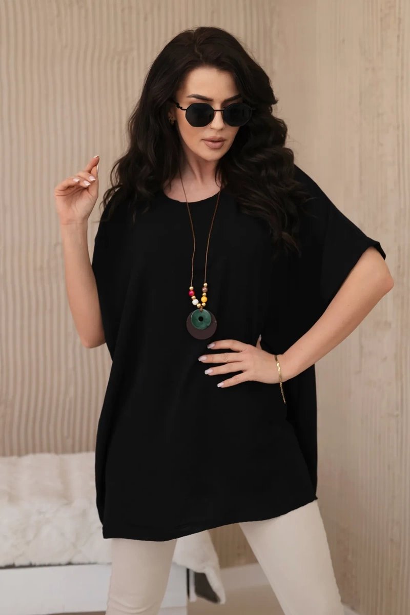 Oversized blouse with black pendant