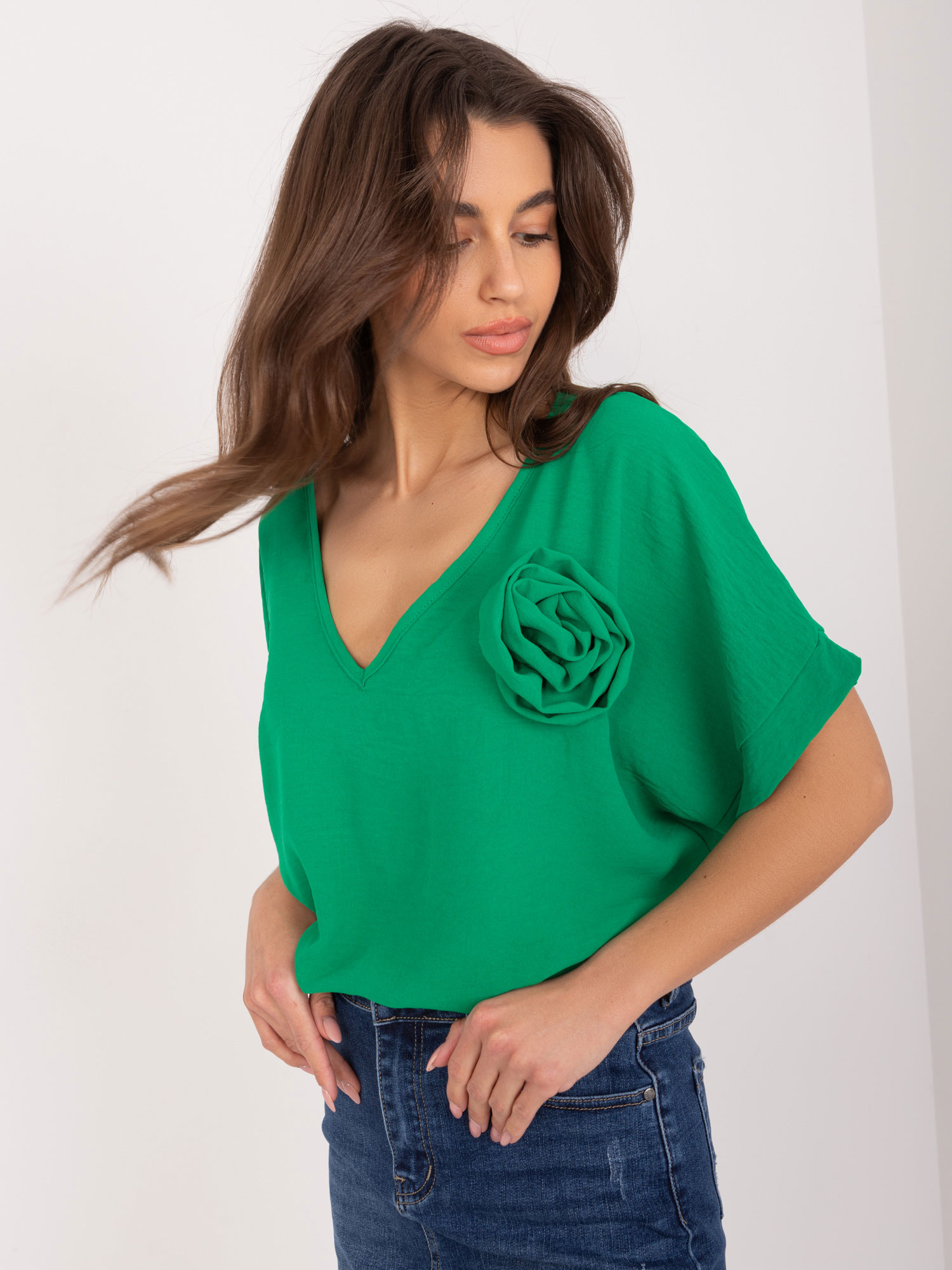 Green women's oversize blouse with flower