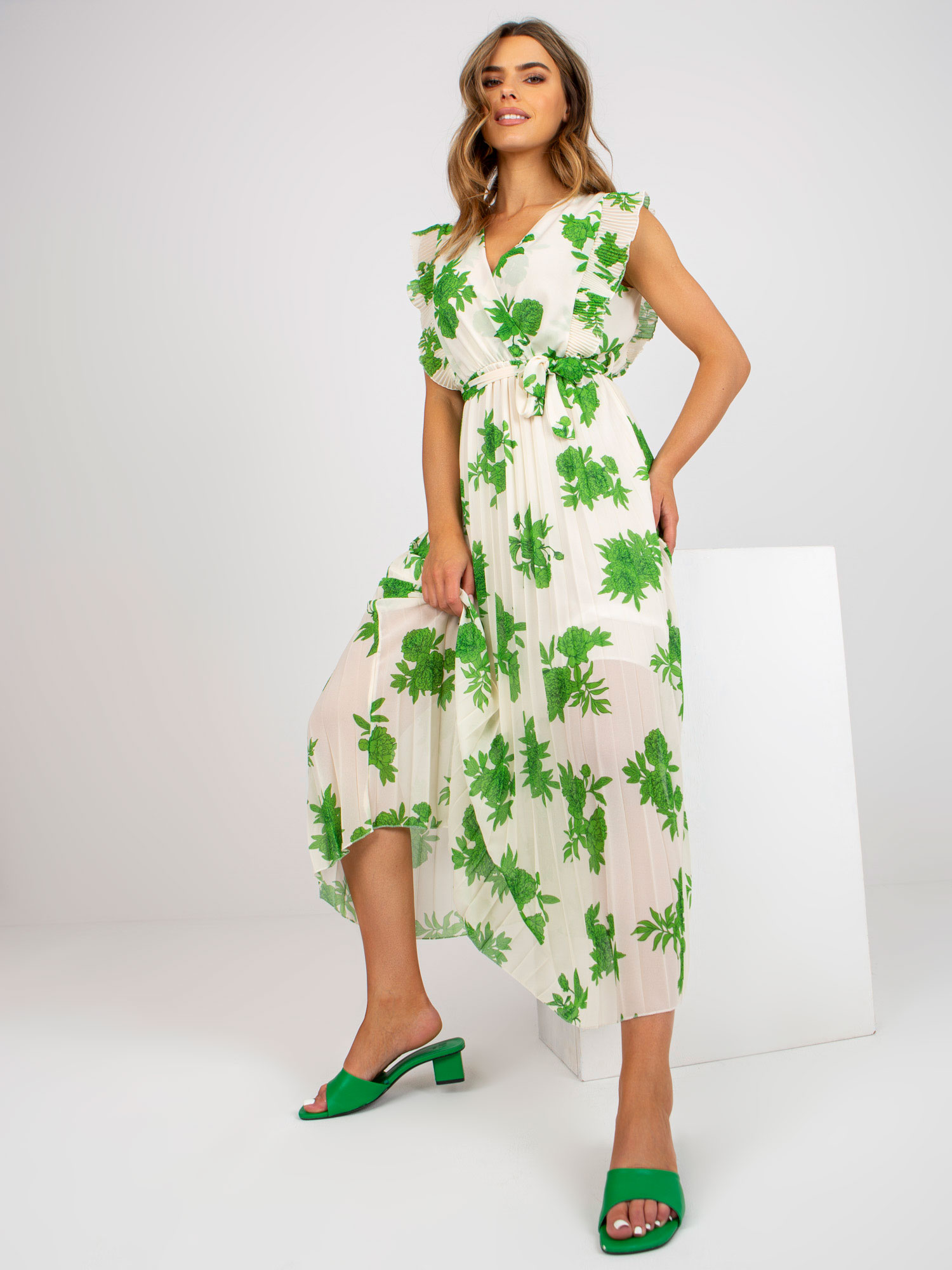 Long, beige and green dress with prints and belt