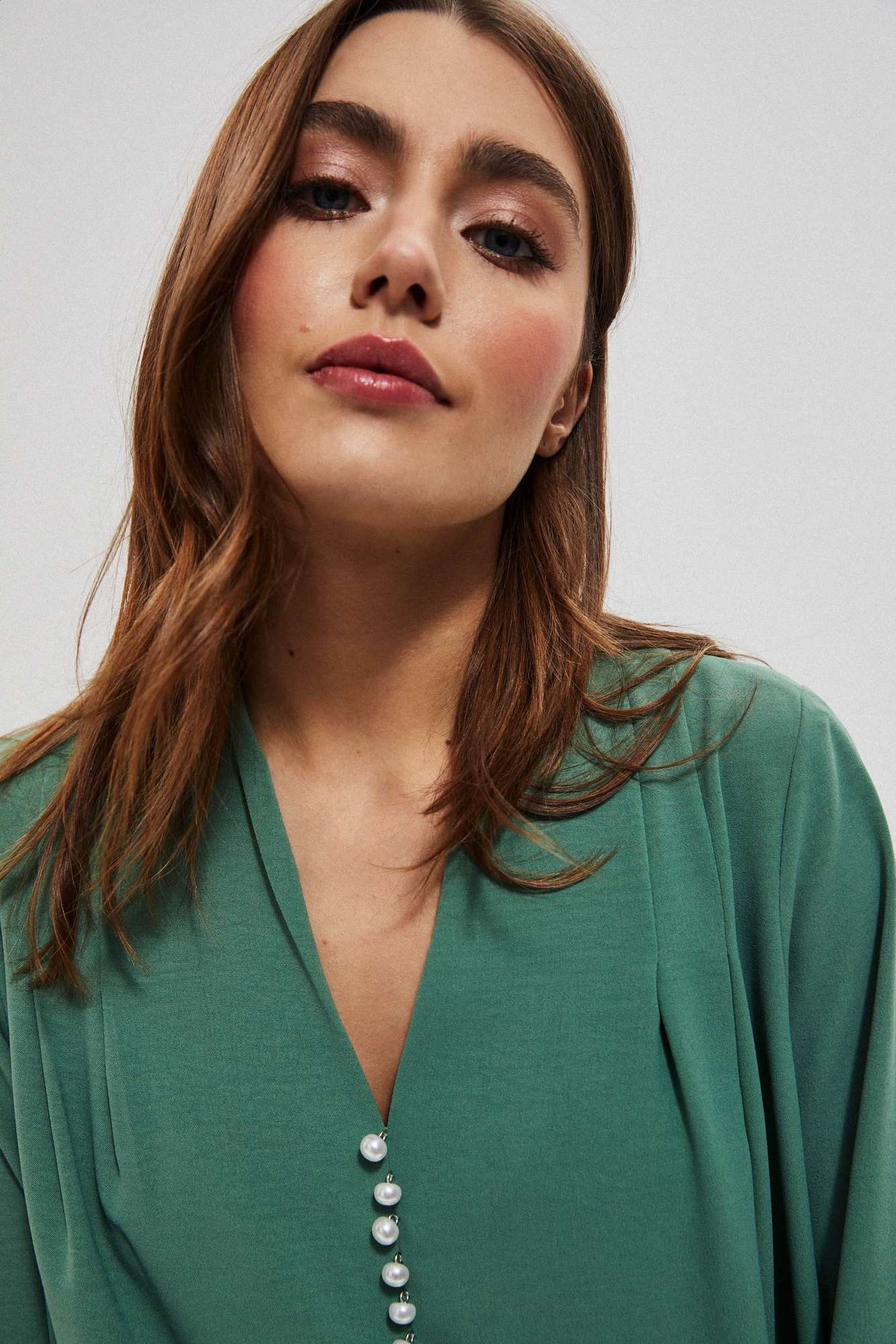 Plain shirt with decorative appliqué