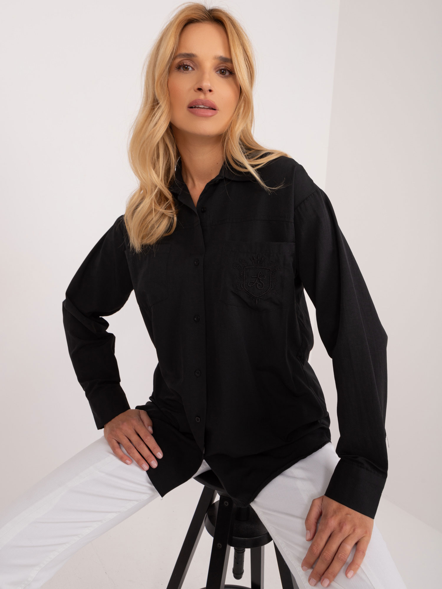 Women's black button-down shirt with patch