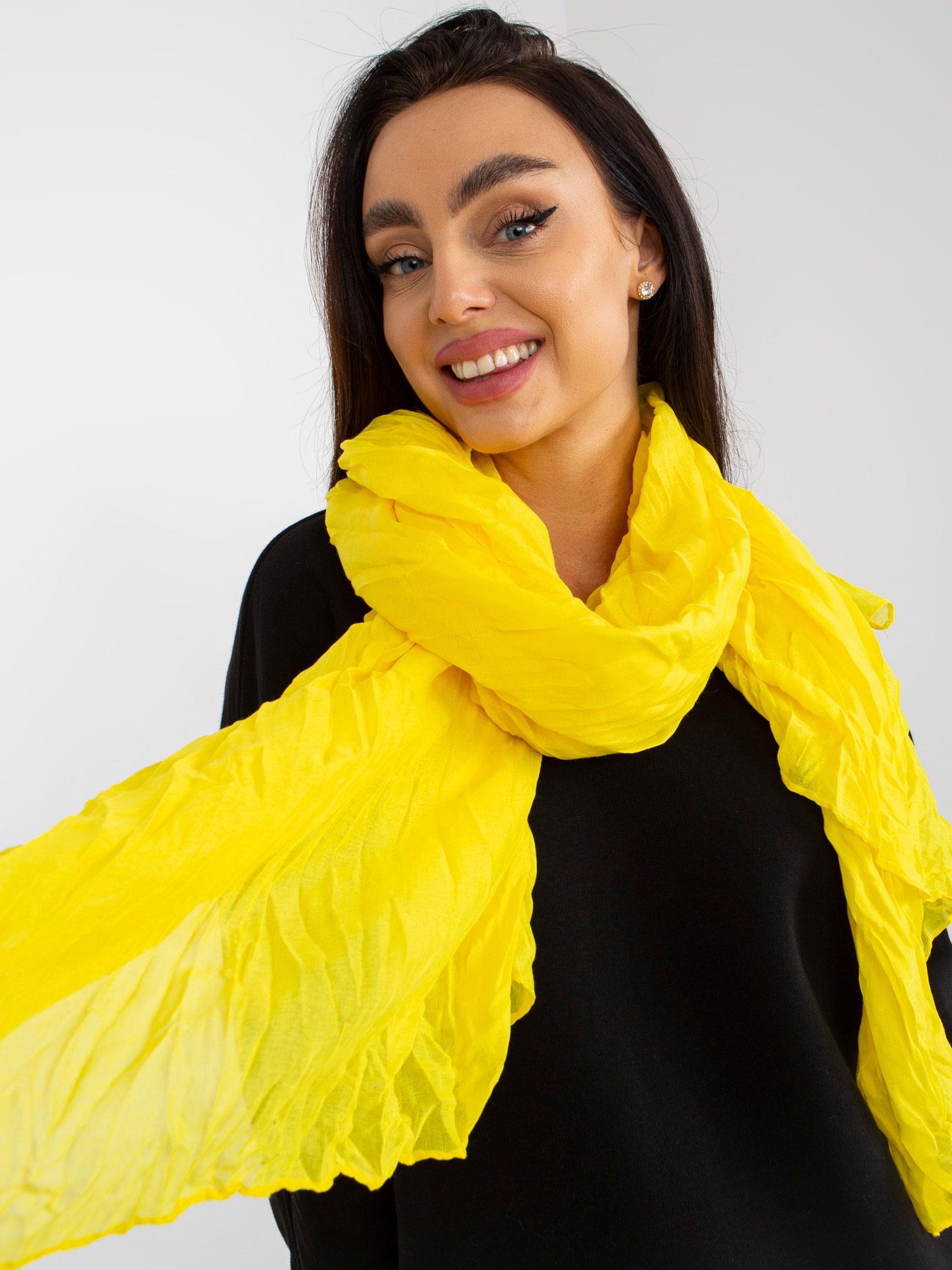 Light yellow airy scarf with wrinkles
