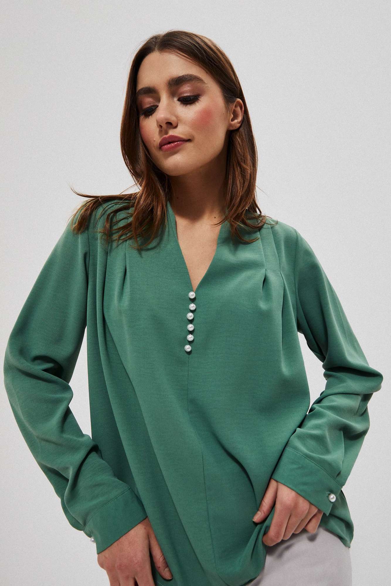 Plain shirt with decorative appliqué