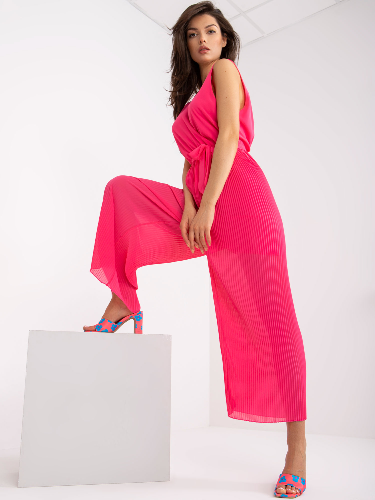 Pink long pleated jumpsuit with wide legs