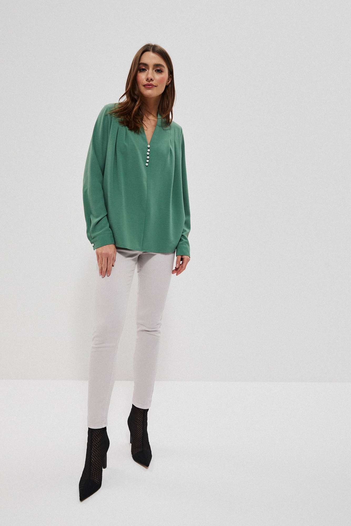 Plain shirt with decorative appliqué
