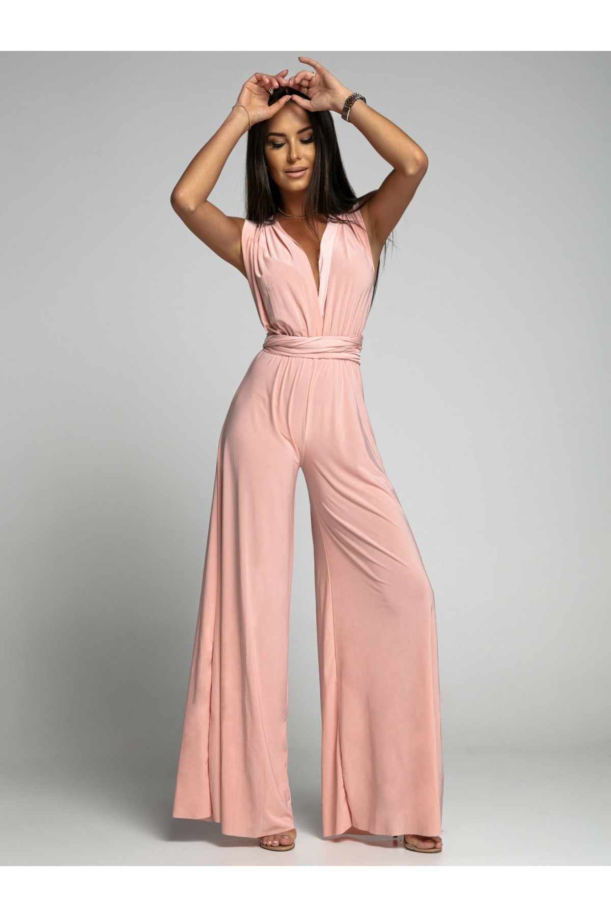 Powder-coloured jumpsuit tied in several ways