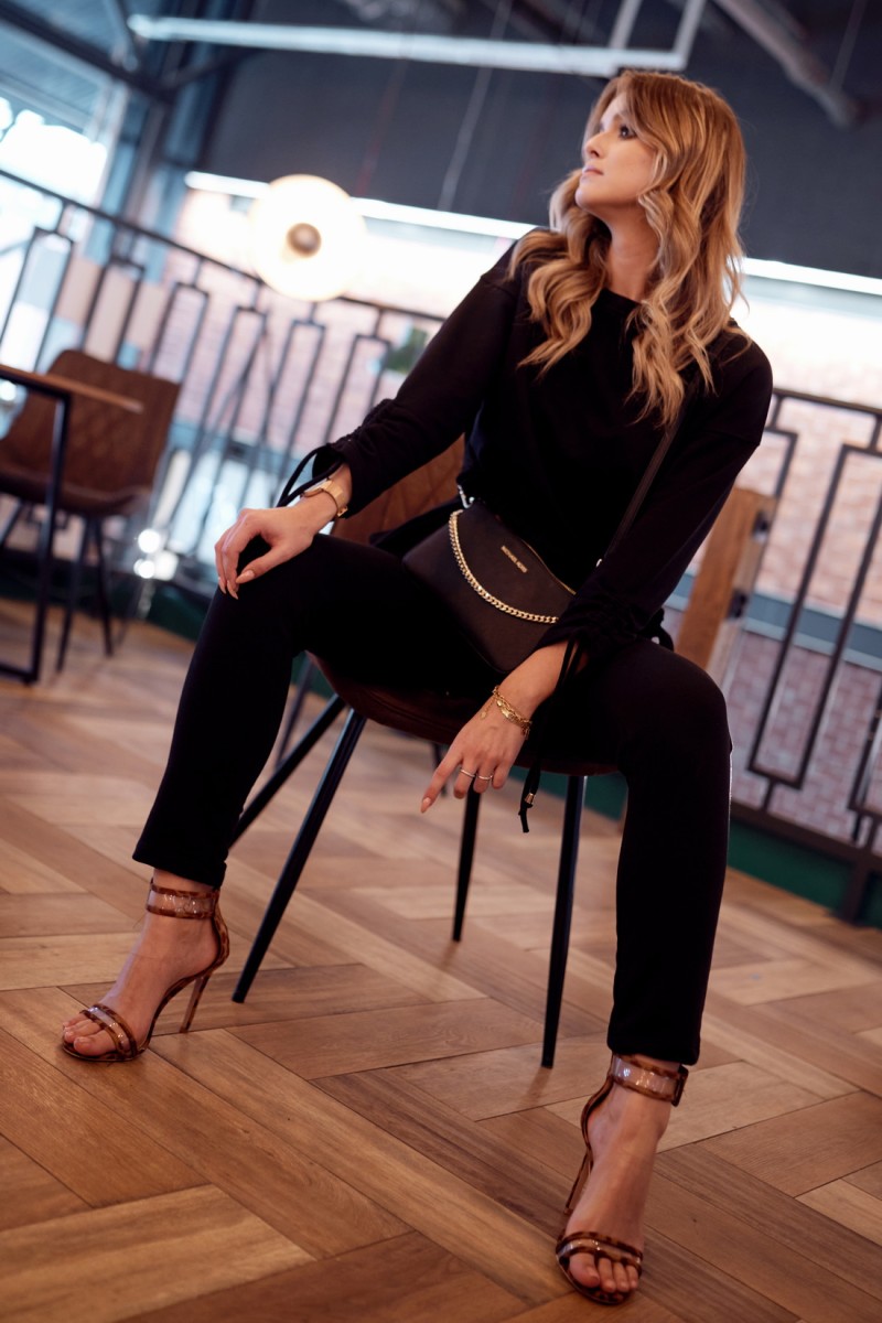 Ordinary women&#039;s tracksuit with asymmetrical black sweatshirt