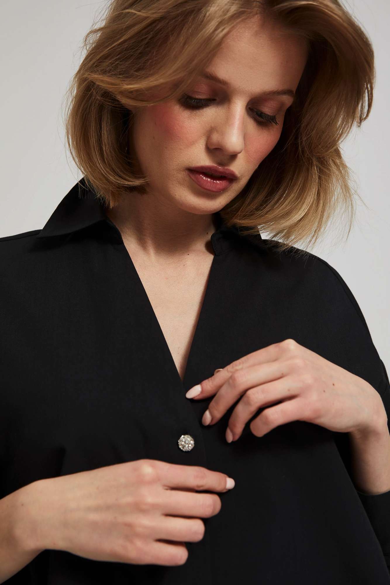 Shirt with decorative buttons