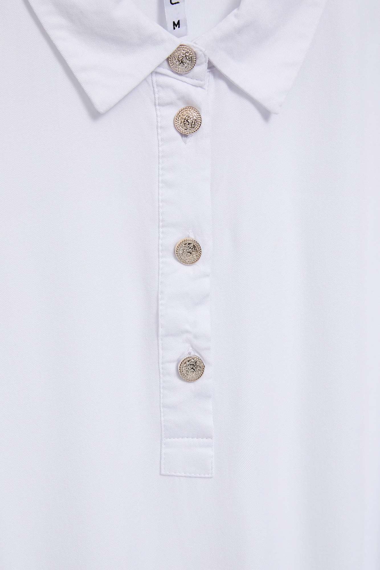 Shirt with decorative buttons