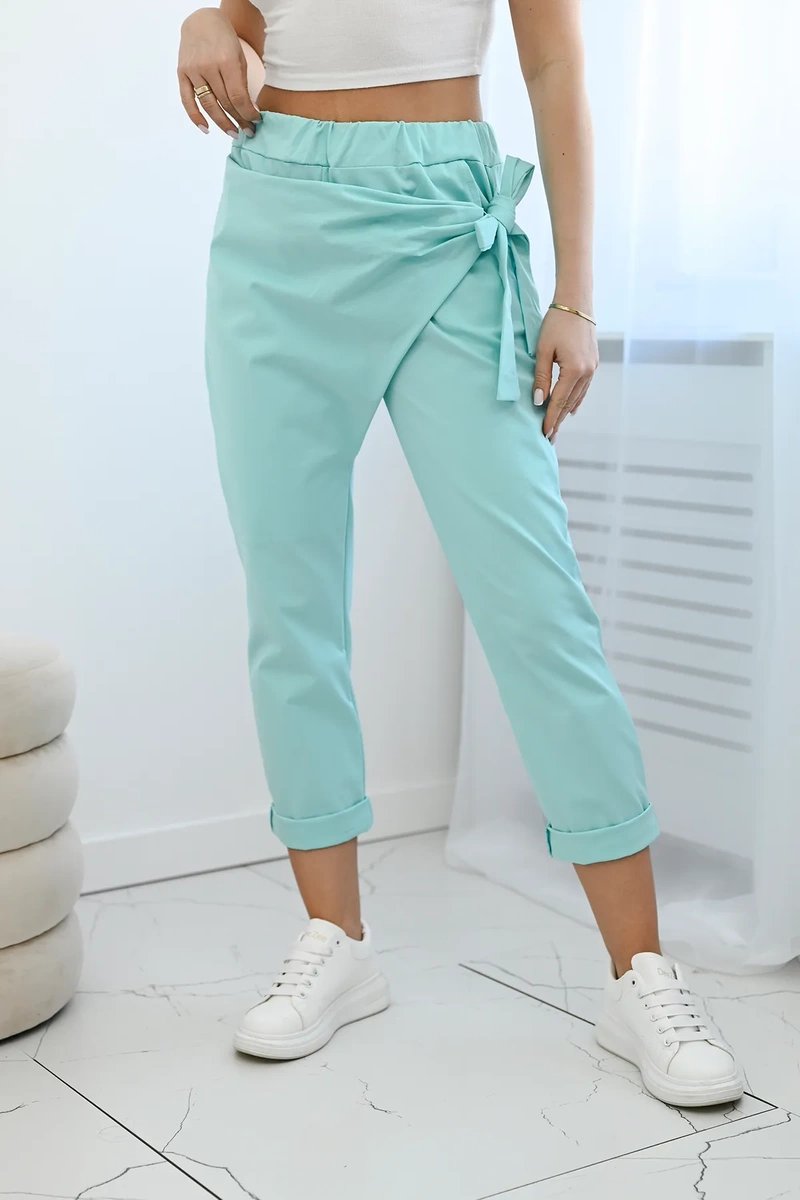 Trousers with asymmetrical mint tie at the front
