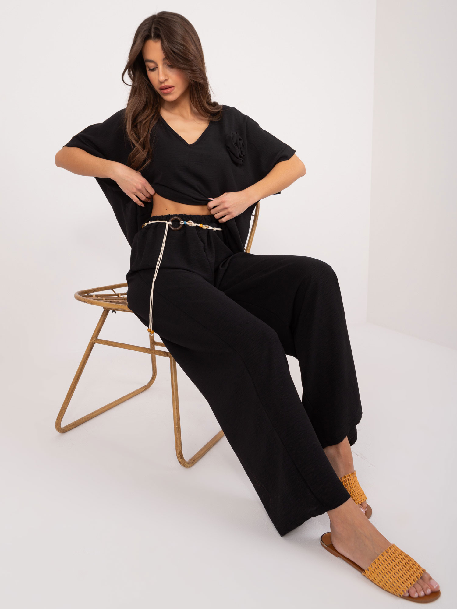 Black fabric trousers with straight legs