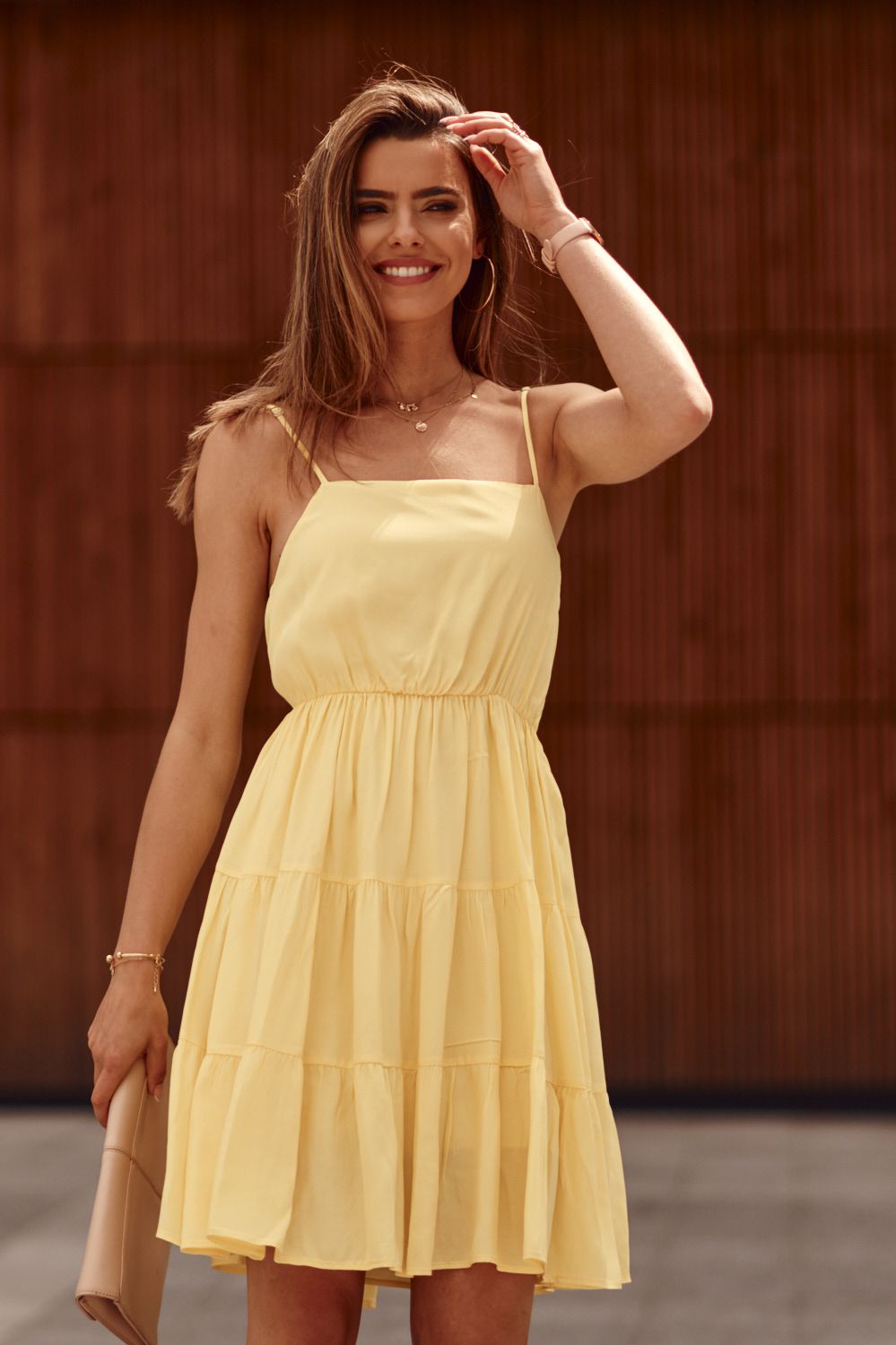 Yellow dress with thin straps and ruffles