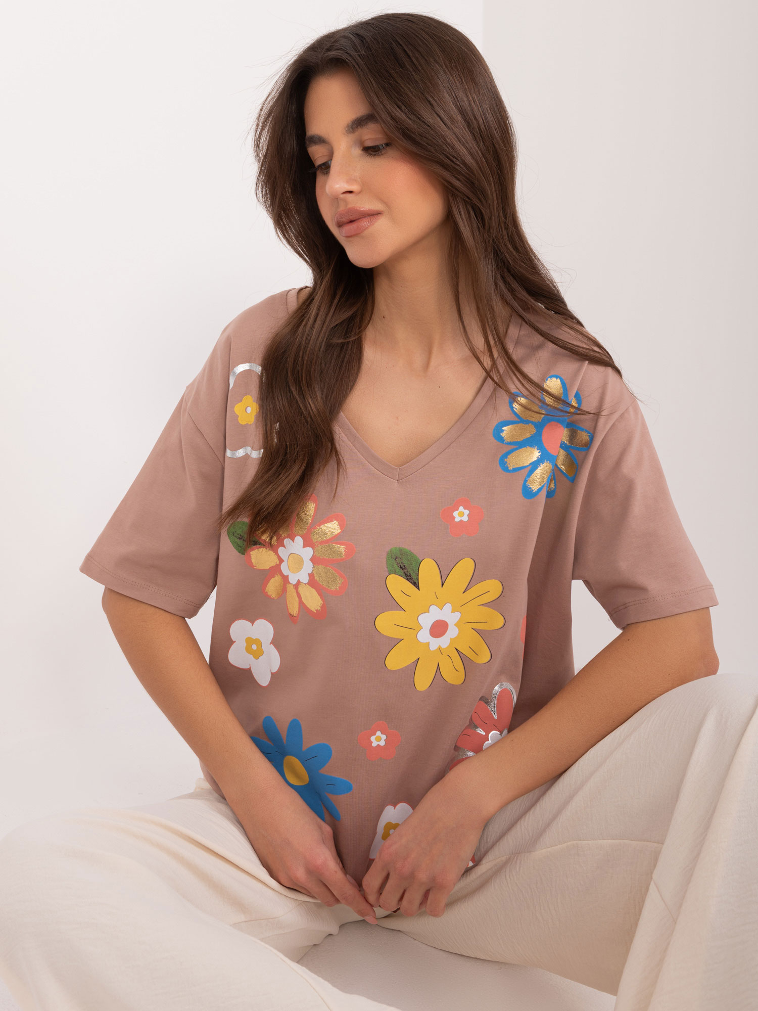 Light brown women's blouse with a printed neckline