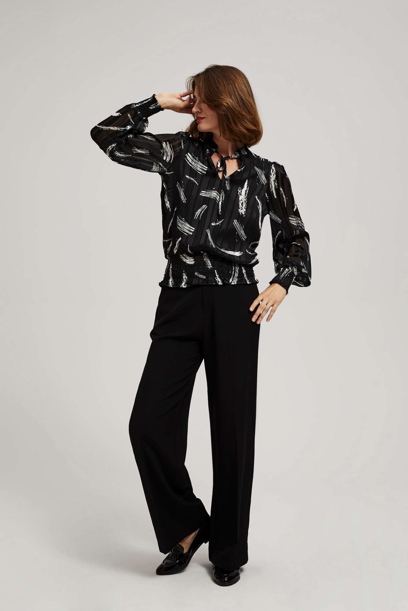 Shirt with a tied neckline