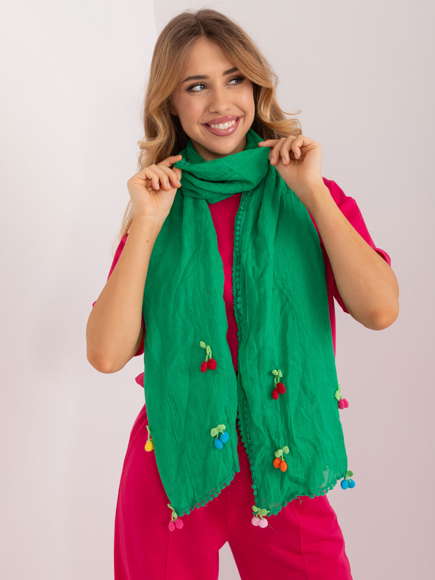 Green long women's scarf with appliqués