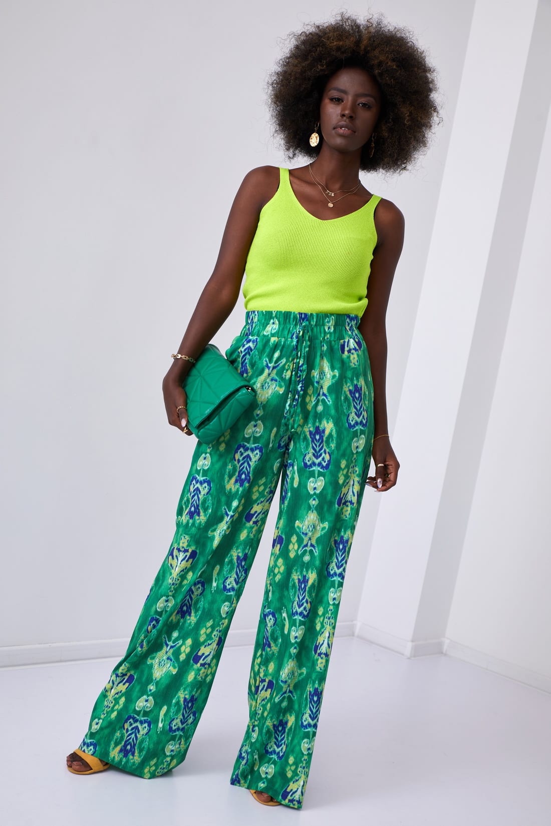 Short knitted blouse with lime green shoulder straps