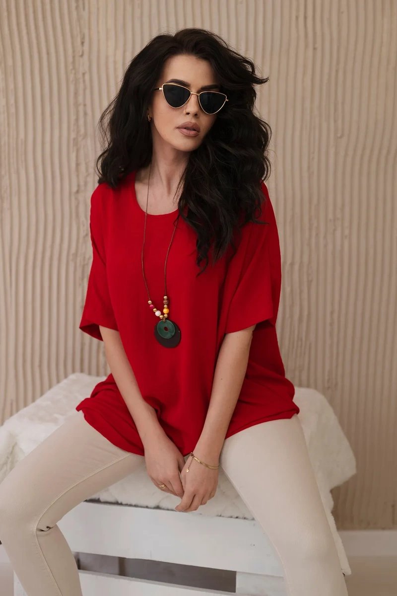 Oversized blouse with red pendant