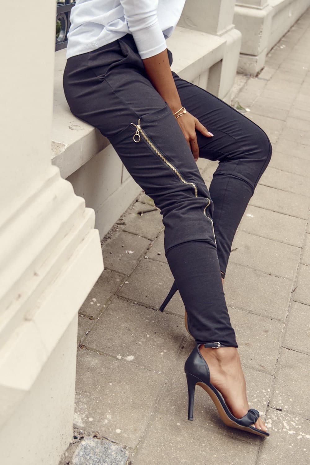 Set of women&#039;s cargo pants and a white and black blouse
