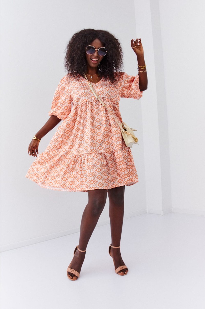 Loose dress with puff sleeves in light orange