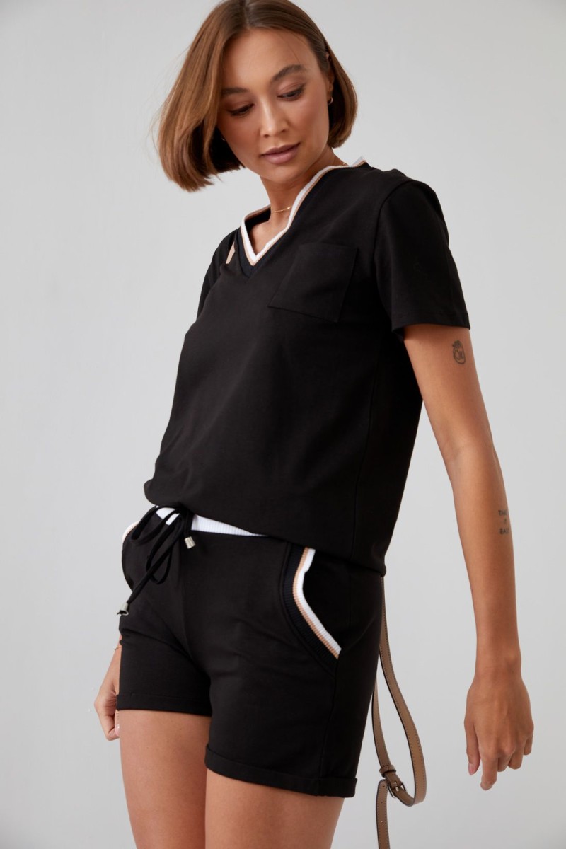 Women&#039;s summer ensemble with black shorts