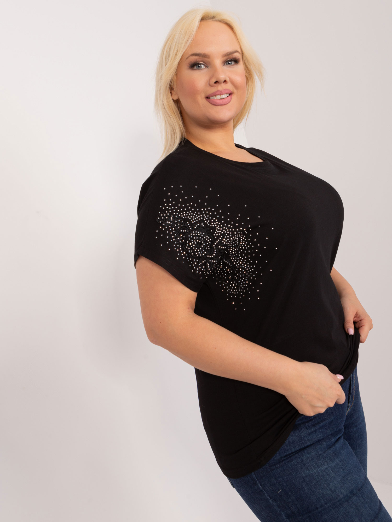 Black casual blouse with decorative patch on the sleeve