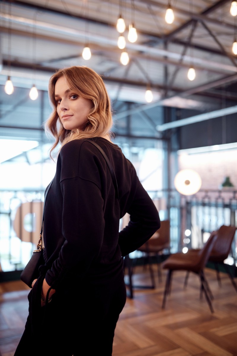 Ordinary women&#039;s tracksuit with asymmetrical black sweatshirt