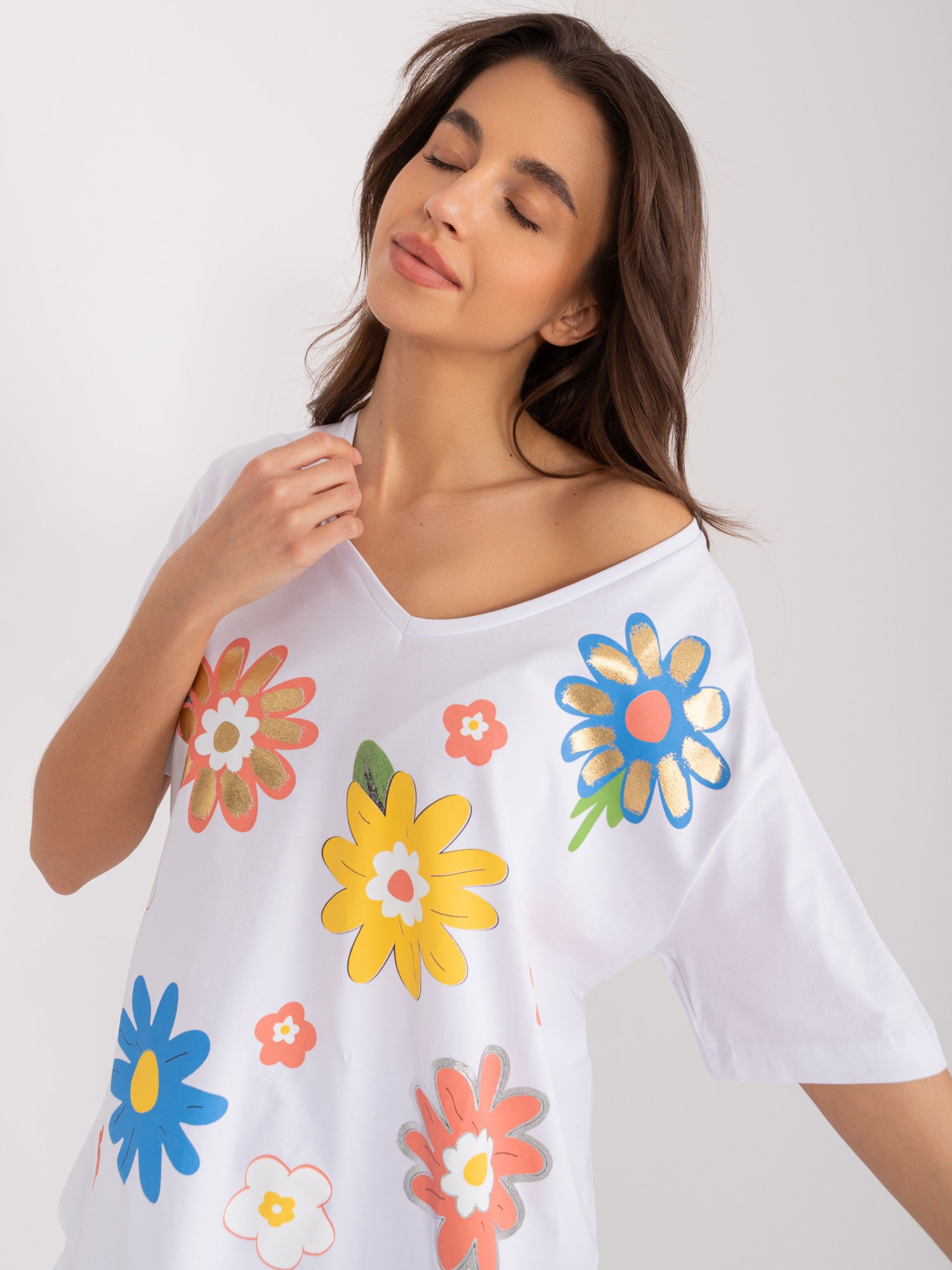 White loose women's blouse with floral pattern
