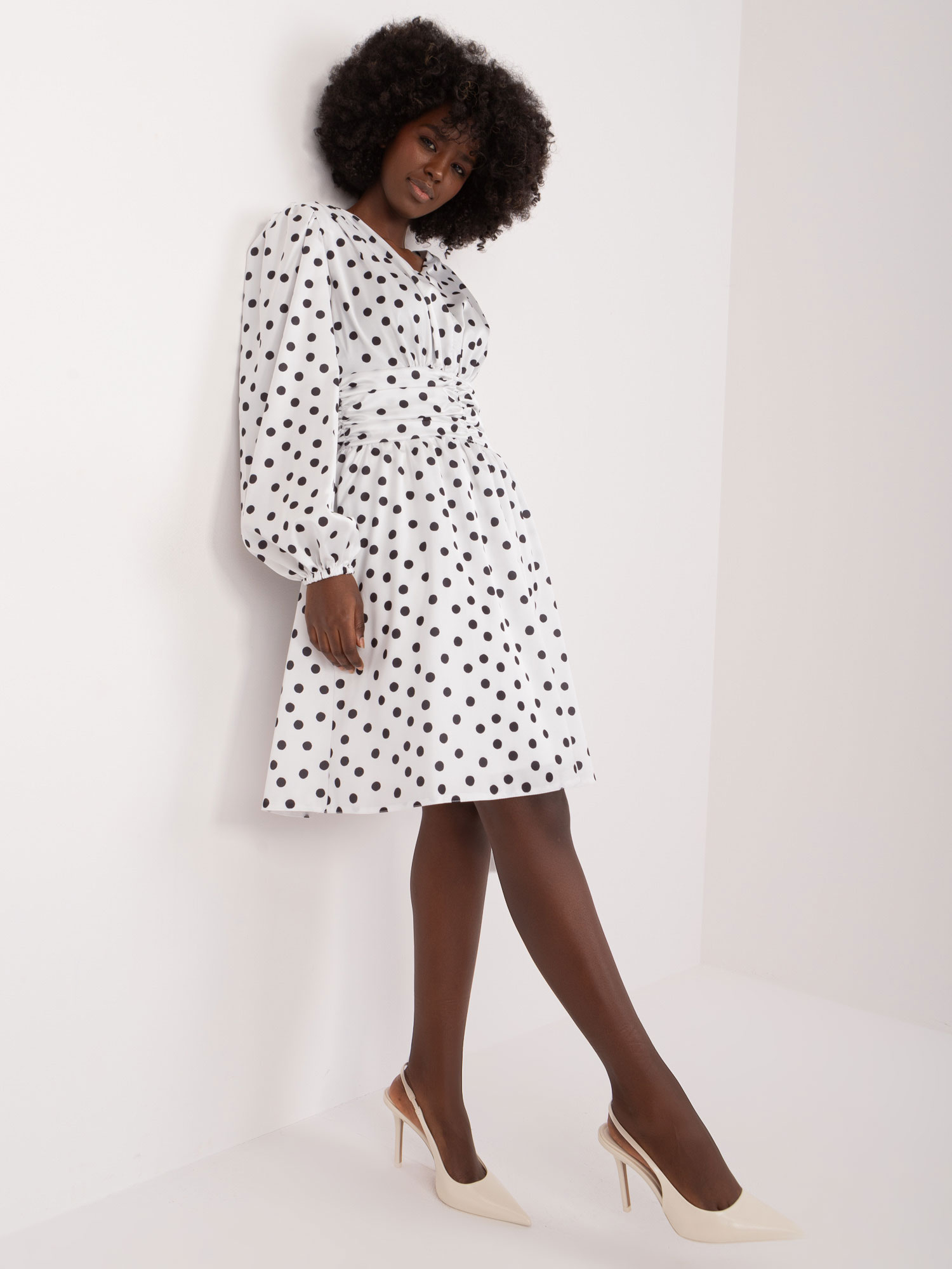 White flared cocktail dress with polka dots