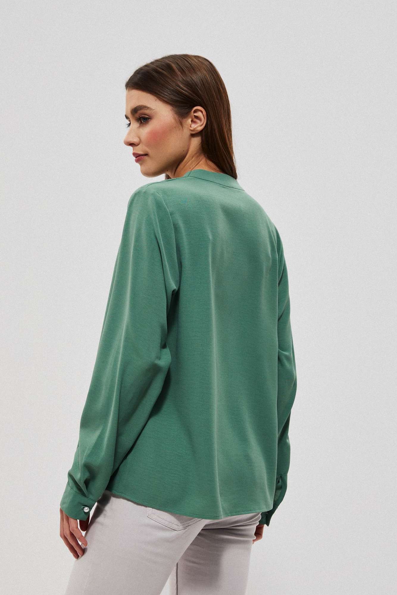 Plain shirt with decorative appliqué