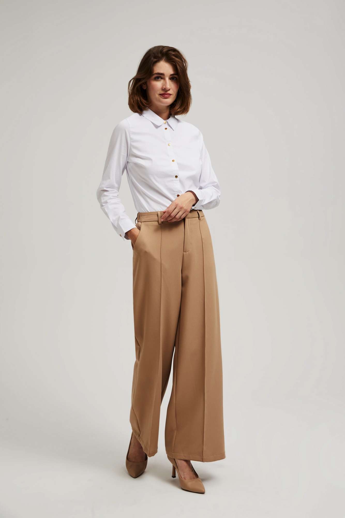 Plain shirt with decorative buttons