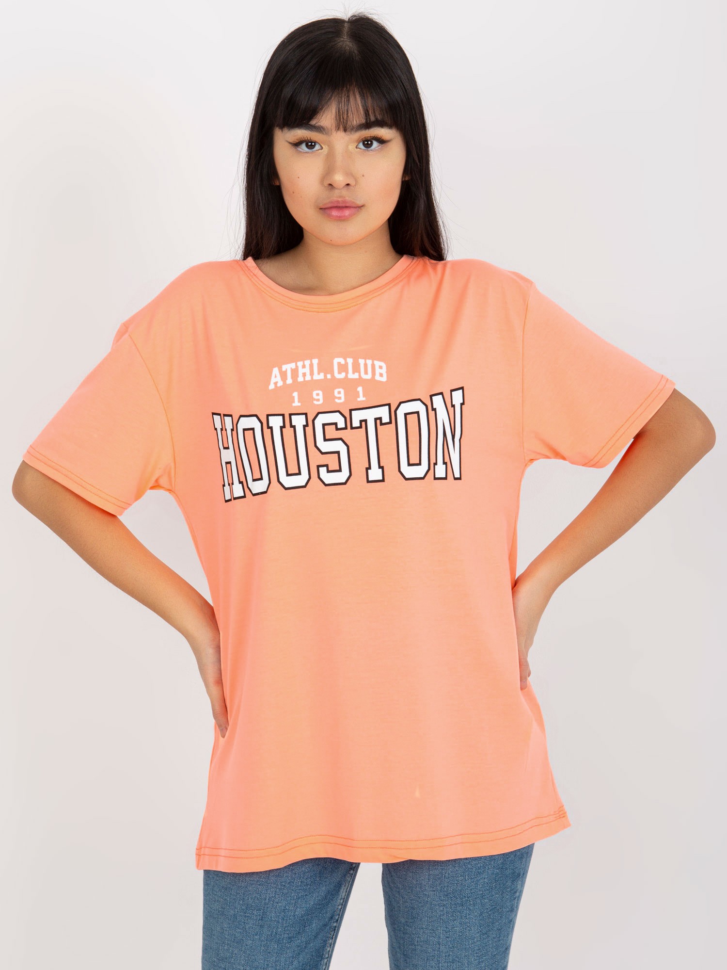Levně Fluo oranžové volné dámské tričko s nápisem